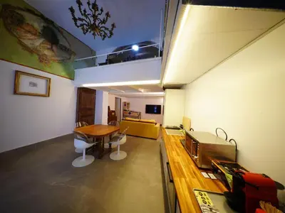 a room with a table and a dining room at Tre Colonne in Rome