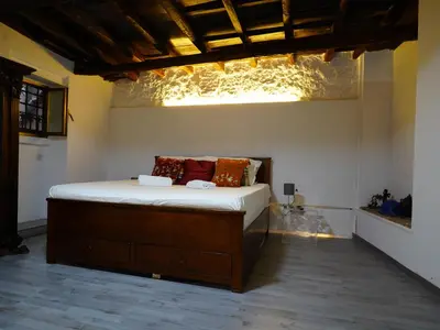 a bedroom with a bed in a room at Tre Colonne in Rome