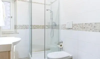 a bathroom with a shower and a toilet and a sink at PeoniaMaximaHouse -Piazza Bologna- in Rome