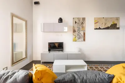 a living room with a couch and a table at Fantastic Penthouse over the Roman Sky in Rome