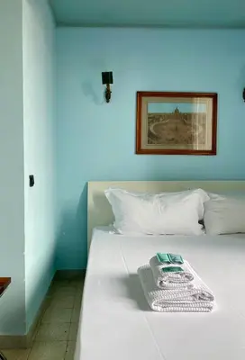 a white bed with a tray on top of it at Residenza Prati - ZEN24 in Rome
