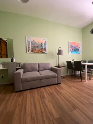 a living room with a couch and a table at Carpegna42 in Rome