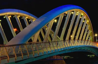 a blue and white bridge at night at Maison Flaminio in Rome