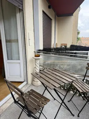 a pair of chairs and a bench on a balcony at Appartamento Garbatella in Rome