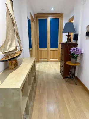 a room with a wooden table with a boat on it at Appartamento Garbatella in Rome