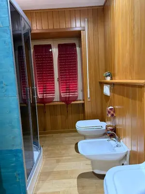 a bathroom with two toilets and a shower at Appartamento Garbatella in Rome