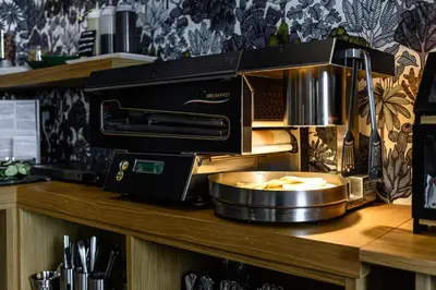aounter with a coffee machine on top of a counter at Central Lodge Hotel in Rome