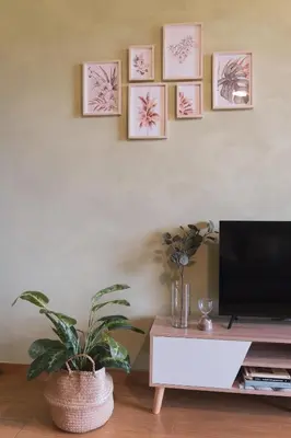 a living room with a tv and a potted plant at Marconi 31 Rome Holiday House - Rome Vacation M&D in Rome