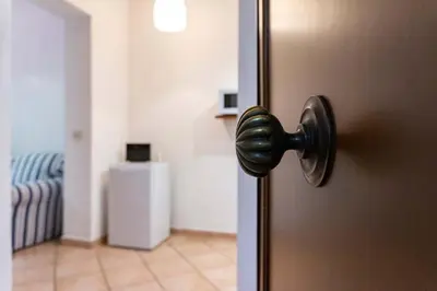 a door with a knob in a room at EasyTopStay - Monti Studio Apartment in Rome