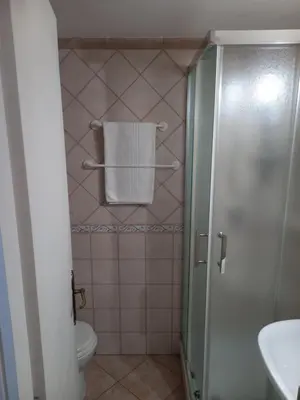 a bathroom with a toilet and a towel at Casa Campo de' Fiori in Rome