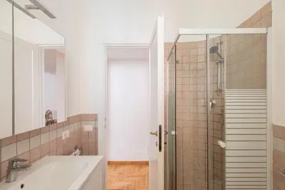 a bathroom with a bath tub and a shower at iFlat Red Roman Apartament in Rome