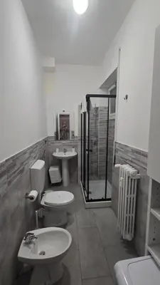 a bathroom with two sinks and a shower at Home Rome Center in Rome