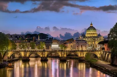 a bridge over a river with a building at Ottaviano - 10 min dal Vaticano in Rome