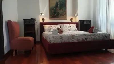 a bedroom with a bed with two teddy bears on it at 2MG: appartamento con terrazzo nel cuore di Roma! in Rome