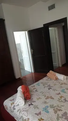 a bedroom with a bed with towels on it at 2MG: appartamento con terrazzo nel cuore di Roma! in Rome