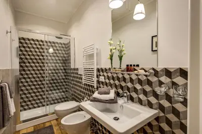 a bathroom with a sink and a toilet and a shower at TLV Navona in Rome