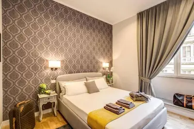 a bedroom with a bed in a room with a window at TLV Navona in Rome