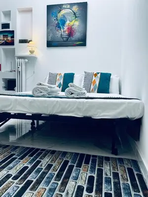 a large bed sitting on top of a room at Suite San Damaso in Rome
