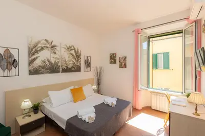 a bedroom with a bed with two stuffed animals on it at Turati by Rental in Rome in Rome