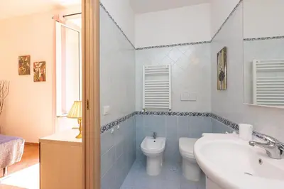 a bathroom with a toilet and a sink at Turati by Rental in Rome in Rome
