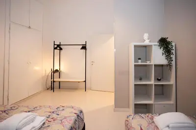 a room with a bed and a room with a closet at Persia Collection Colosseo in Rome