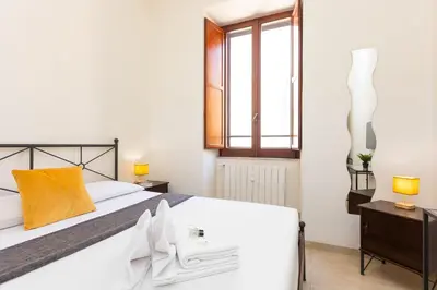a bedroom with a bed and a window at Vatican Museum by Rental in Rome in Rome