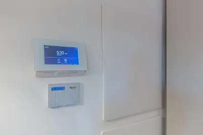 a monitor on the wall of a refrigerator at Luxury Trastevere gym & rooftop 5H in Rome