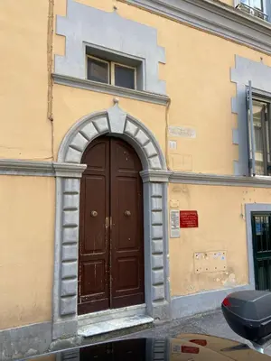 a brown door on the side of a building at Laura Apartment in Rome