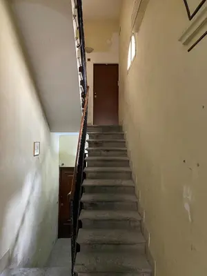 a stairway in an old building with a stair railing at Laura Apartment in Rome