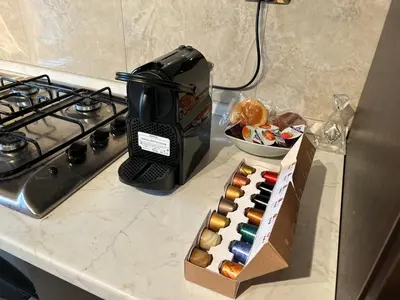 a box of donuts on a counter next to a stove at Carpegna Luxury apt with terrace in Rome