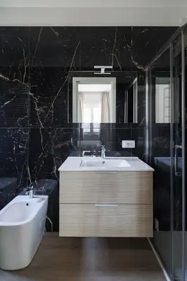 a bathroom with a sink and a tub and a mirror at Gianicolense 22 in Rome