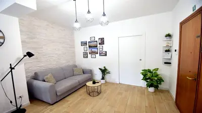 a living room with a couch and a table at A due passi da Trastevere in Rome
