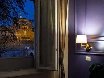 a window with a view of the eiffel tower at Alto Apartment in Rome