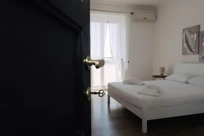 a bedroom with a bed and a window at Appartamento San Giovanni Liliana in Rome