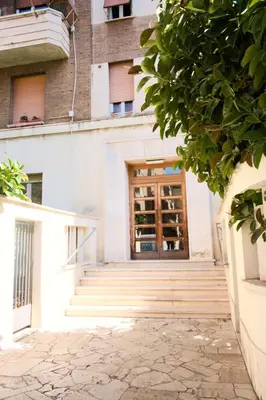 a door to a building with stairs in front at Appartamento San Giovanni Liliana in Rome
