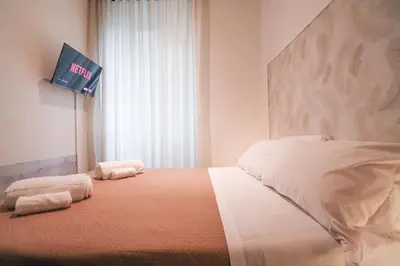 a bedroom with a bed with two towels on it at A 10 passi dal Vaticano in Rome