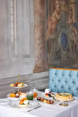 a table with plates of food on top of it at Palazzo Roma - The Leading Hotels of the World in Rome