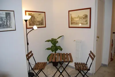a dining room with a table and two chairs at Residenza Flaminia in Rome
