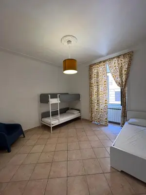 a bedroom with a bed and a window at Signorina In Rome in Rome