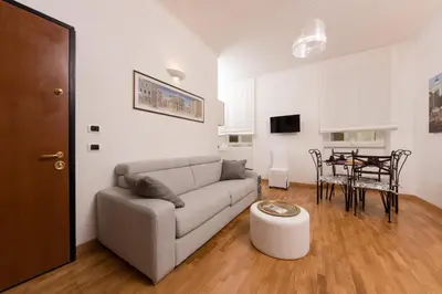 a living room with a couch and a table at Baccina Inn in Rome