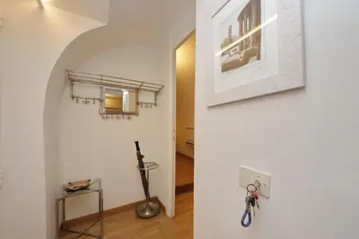 a room with a bike hanging on the wall at Fontanella Borghese CORI apartment in Rome