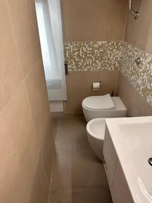 a bathroom with a toilet and a sink at PARIOLI LUXURY SUITe II in Rome