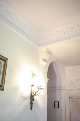 a room with a ceiling with a cross on the wall at Bpremium apartment in Rome