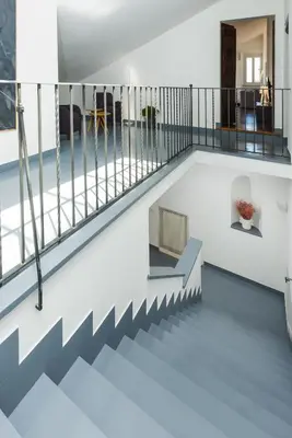 a view from the top floor of a house with stairs at Nikis Maison Navona - 4th floor no elevator in Rome