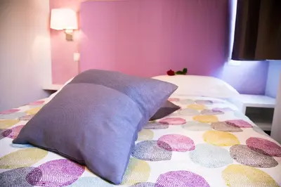 a bedroom with a bed with a pillow on it at Modern BnB in Rome