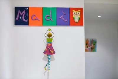 a doll is hanging on a wall in a museum at Madì B&B in Rome