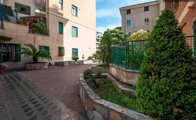 a street in a city with buildings and a tree at Bed & Puppets in Rome