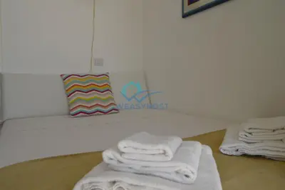 two towels are sitting on a bench in a bathroom at Oasis of Ample Space and Comfort in Rome