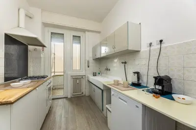 a kitchen with white counters and white cabinets at Presidential Vatican Palace in Rome