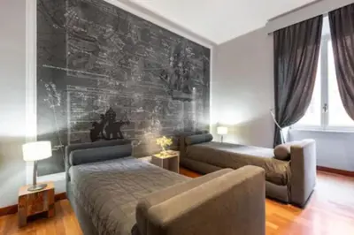 a living room with two beds and a couch at Cristina's Home in Rome